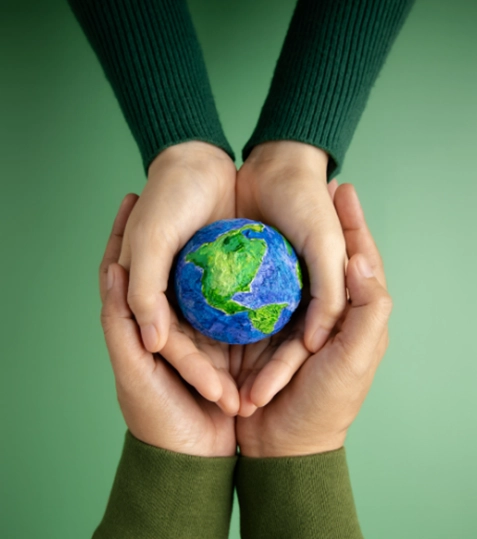 An image of a globe placed in the hands